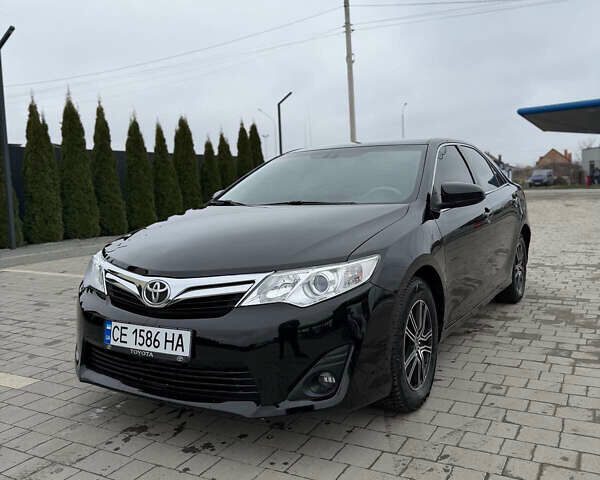 Черный Тойота Камри, объемом двигателя 2.5 л и пробегом 190 тыс. км за 14777 $, фото 1 на Automoto.ua