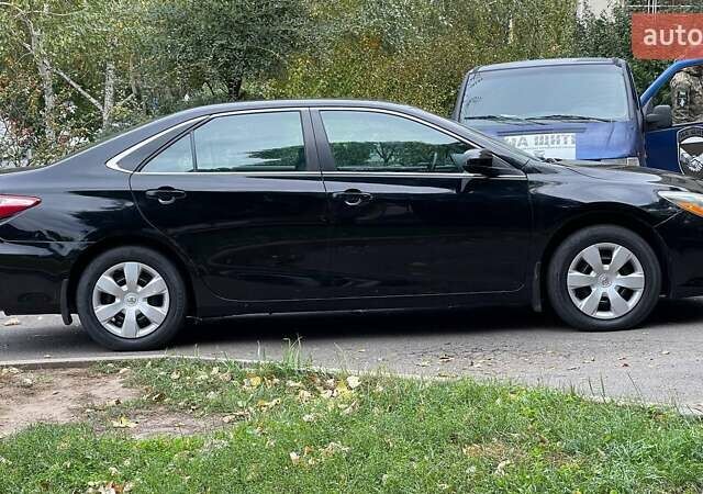 Черный Тойота Камри, объемом двигателя 2.5 л и пробегом 205 тыс. км за 12500 $, фото 1 на Automoto.ua