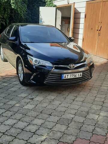 Черный Тойота Камри, объемом двигателя 2.49 л и пробегом 200 тыс. км за 13850 $, фото 1 на Automoto.ua