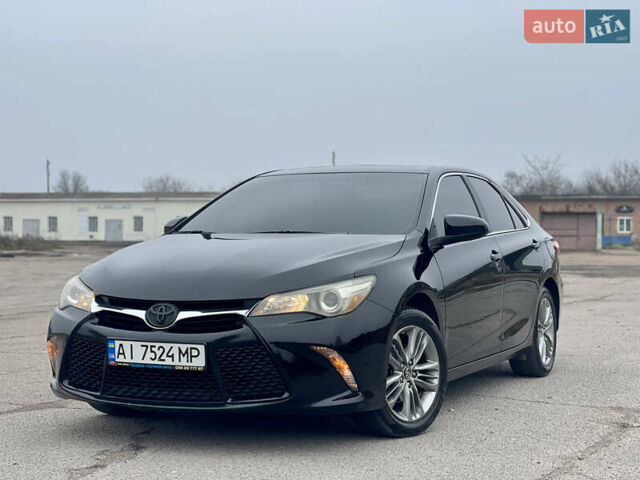 Черный Тойота Камри, объемом двигателя 2.49 л и пробегом 145 тыс. км за 11999 $, фото 1 на Automoto.ua