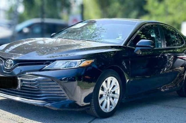 Черный Тойота Камри, объемом двигателя 2.5 л и пробегом 60 тыс. км за 14700 $, фото 1 на Automoto.ua