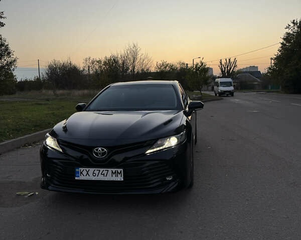 Черный Тойота Камри, объемом двигателя 2.49 л и пробегом 175 тыс. км за 21800 $, фото 1 на Automoto.ua