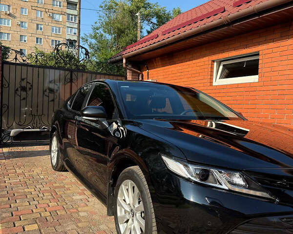 Черный Тойота Камри, объемом двигателя 2.49 л и пробегом 260 тыс. км за 19400 $, фото 1 на Automoto.ua