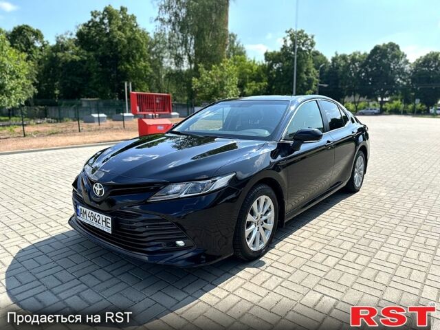 Черный Тойота Камри, объемом двигателя 2.5 л и пробегом 115 тыс. км за 24500 $, фото 1 на Automoto.ua