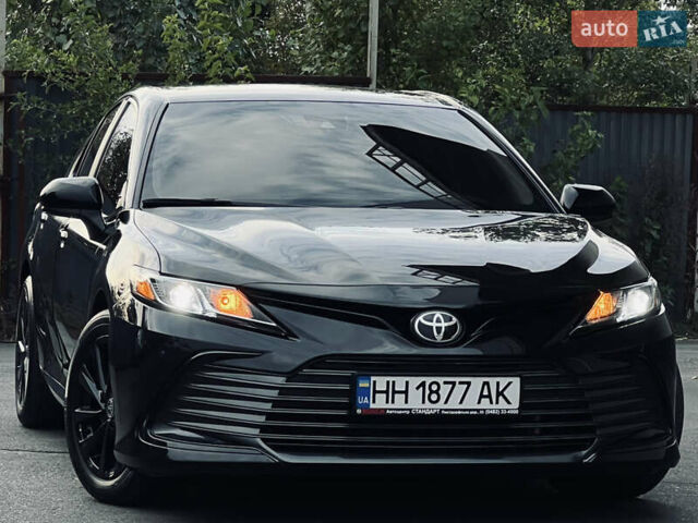 Черный Тойота Камри, объемом двигателя 2.5 л и пробегом 57 тыс. км за 23700 $, фото 1 на Automoto.ua