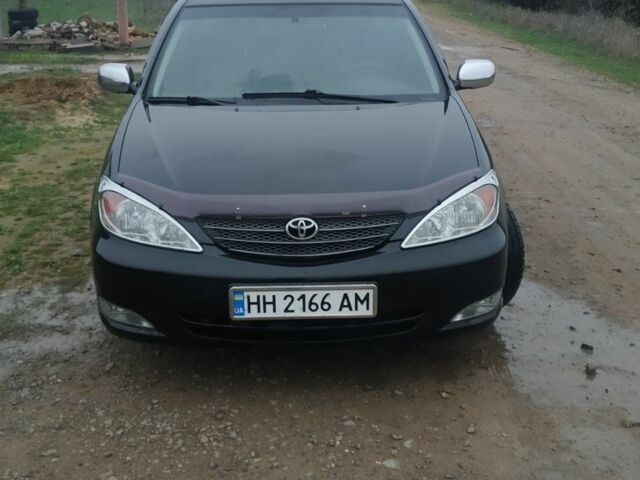 Черный Тойота Камри, объемом двигателя 2.4 л и пробегом 290 тыс. км за 7000 $, фото 1 на Automoto.ua