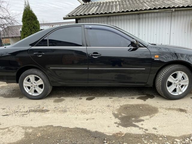 Черный Тойота Камри, объемом двигателя 2.4 л и пробегом 250 тыс. км за 6500 $, фото 1 на Automoto.ua