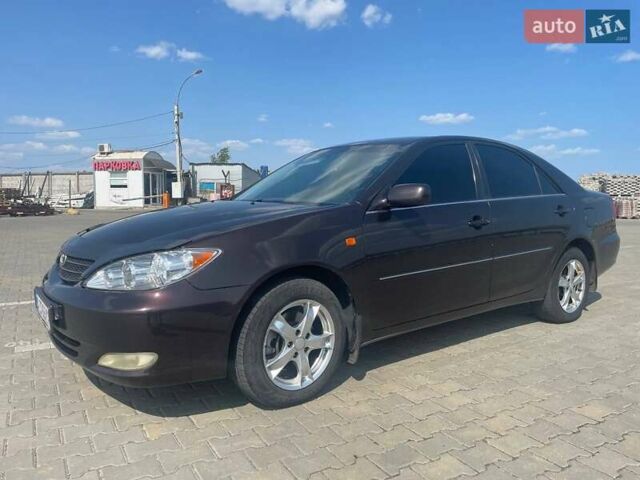 Коричневий Тойота Камрі, об'ємом двигуна 2.4 л та пробігом 320 тис. км за 4700 $, фото 1 на Automoto.ua