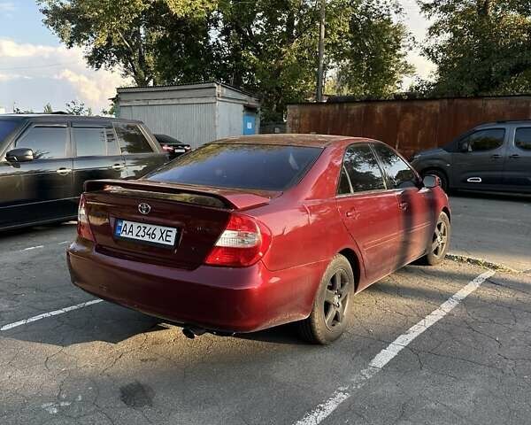 Красный Тойота Камри, объемом двигателя 3 л и пробегом 276 тыс. км за 5500 $, фото 1 на Automoto.ua