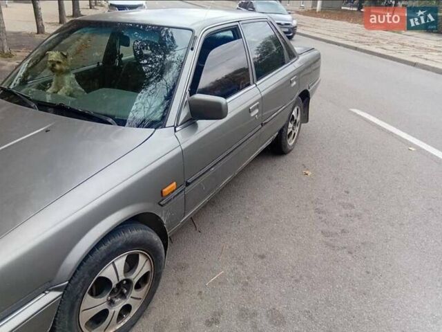 Сірий Тойота Камрі, об'ємом двигуна 2 л та пробігом 359 тис. км за 1399 $, фото 1 на Automoto.ua