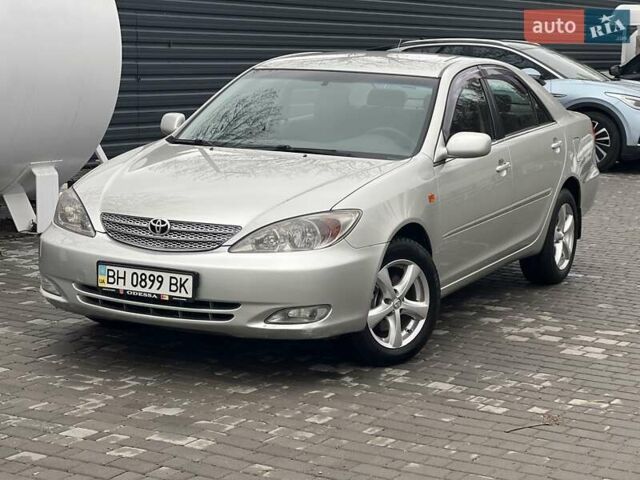 Сірий Тойота Камрі, об'ємом двигуна 2.4 л та пробігом 216 тис. км за 5999 $, фото 1 на Automoto.ua