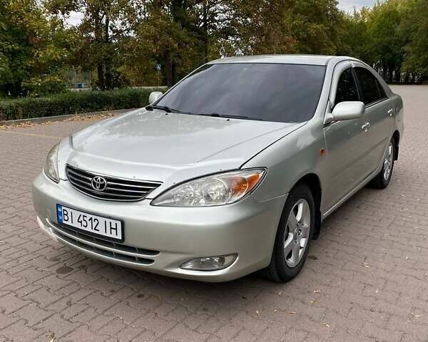Серый Тойота Камри, объемом двигателя 3 л и пробегом 303 тыс. км за 4500 $, фото 1 на Automoto.ua
