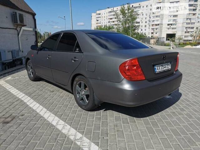 Серый Тойота Камри, объемом двигателя 3 л и пробегом 406 тыс. км за 5500 $, фото 1 на Automoto.ua