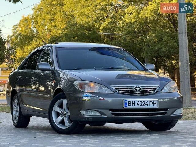 Серый Тойота Камри, объемом двигателя 2.4 л и пробегом 257 тыс. км за 5400 $, фото 1 на Automoto.ua