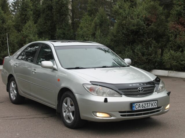 Серый Тойота Камри, объемом двигателя 2.4 л и пробегом 375 тыс. км за 5550 $, фото 1 на Automoto.ua