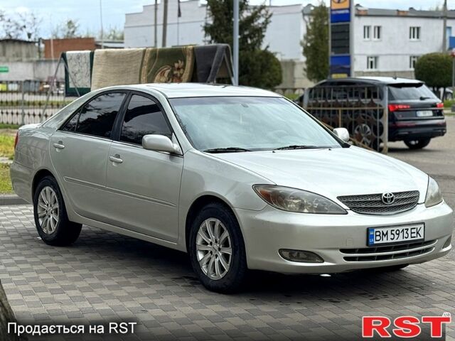 Серый Тойота Камри, объемом двигателя 3 л и пробегом 275 тыс. км за 4500 $, фото 1 на Automoto.ua