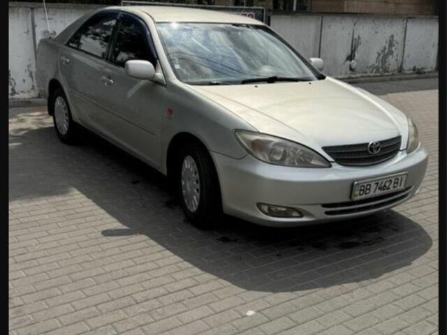 Серый Тойота Камри, объемом двигателя 2.4 л и пробегом 300 тыс. км за 4700 $, фото 1 на Automoto.ua