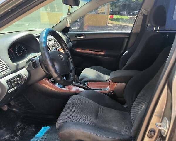 Серый Тойота Камри, объемом двигателя 2.36 л и пробегом 150 тыс. км за 5000 $, фото 1 на Automoto.ua