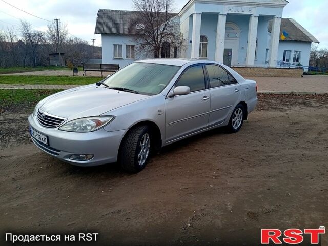 Сірий Тойота Камрі, об'ємом двигуна 2.4 л та пробігом 266 тис. км за 6750 $, фото 1 на Automoto.ua