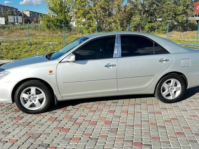 Сірий Тойота Камрі, об'ємом двигуна 3 л та пробігом 112 тис. км за 10800 $, фото 1 на Automoto.ua