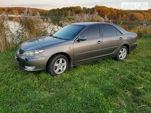 Сірий Тойота Камрі, об'ємом двигуна 3 л та пробігом 230 тис. км за 9500 $, фото 1 на Automoto.ua