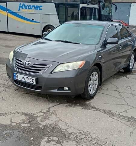 Серый Тойота Камри, объемом двигателя 2.4 л и пробегом 236 тыс. км за 8300 $, фото 1 на Automoto.ua