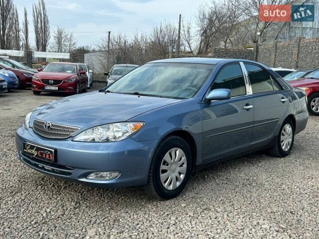 Синій Тойота Камрі, об'ємом двигуна 2.4 л та пробігом 233 тис. км за 4200 $, фото 1 на Automoto.ua