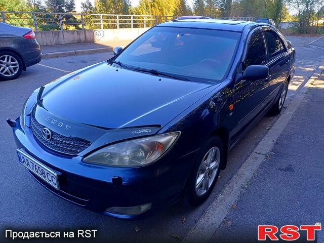 Синій Тойота Камрі, об'ємом двигуна 2.4 л та пробігом 317 тис. км за 5650 $, фото 1 на Automoto.ua