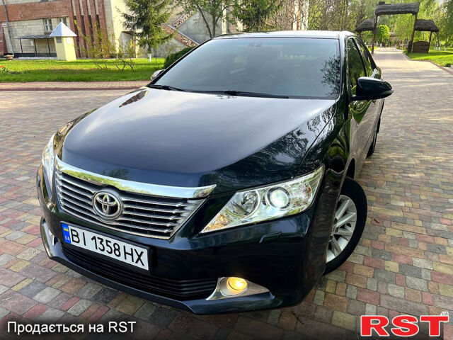 Синий Тойота Камри, объемом двигателя 2.5 л и пробегом 209 тыс. км за 13450 $, фото 1 на Automoto.ua