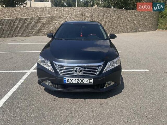 Синий Тойота Камри, объемом двигателя 2.49 л и пробегом 233 тыс. км за 13000 $, фото 1 на Automoto.ua
