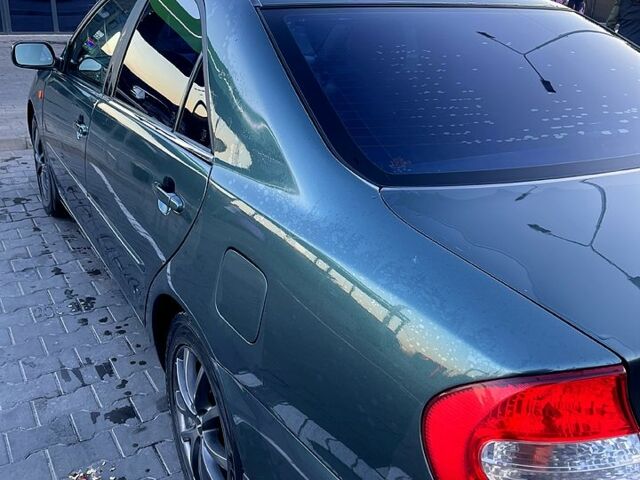 Зеленый Тойота Камри, объемом двигателя 3 л и пробегом 384 тыс. км за 6500 $, фото 1 на Automoto.ua