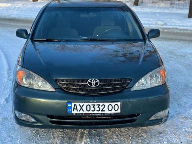 Зеленый Тойота Камри, объемом двигателя 2.4 л и пробегом 200 тыс. км за 5100 $, фото 1 на Automoto.ua