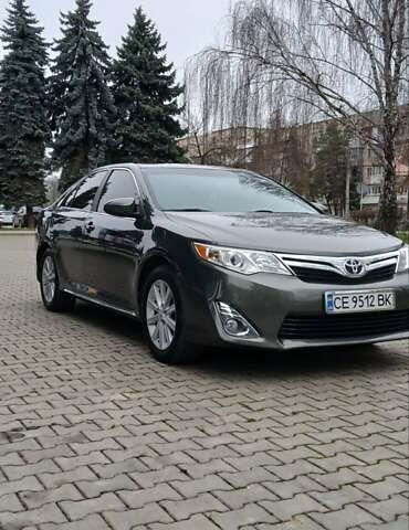 Зеленый Тойота Камри, объемом двигателя 2.5 л и пробегом 230 тыс. км за 11300 $, фото 1 на Automoto.ua