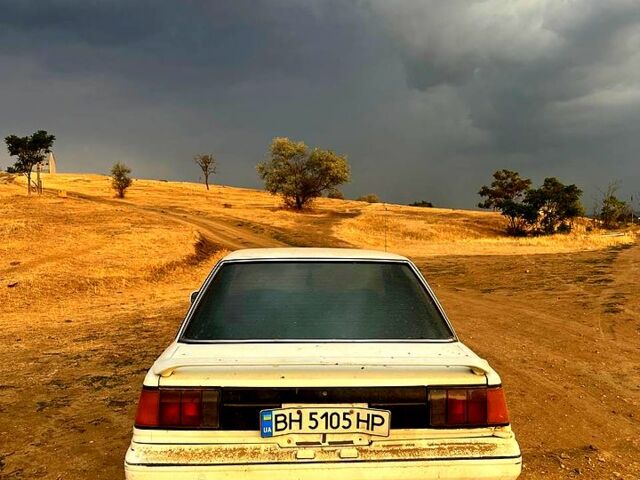 Белый Тойота Карина, объемом двигателя 1.5 л и пробегом 234 тыс. км за 600 $, фото 1 на Automoto.ua