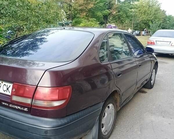 Фиолетовый Тойота Карина, объемом двигателя 1.6 л и пробегом 443 тыс. км за 1800 $, фото 1 на Automoto.ua