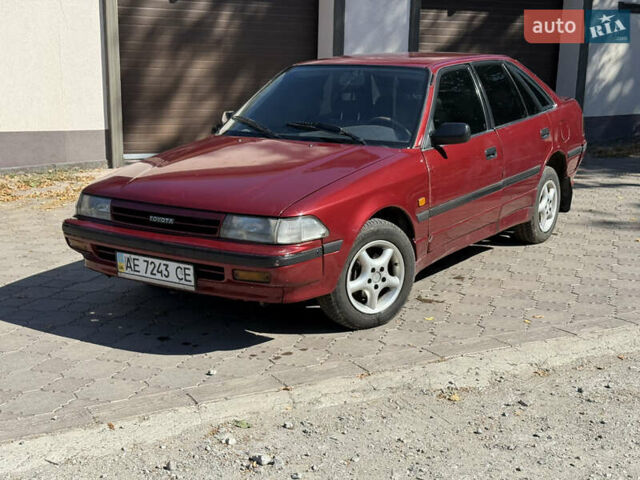 Красный Тойота Карина, объемом двигателя 2 л и пробегом 333 тыс. км за 1375 $, фото 1 на Automoto.ua