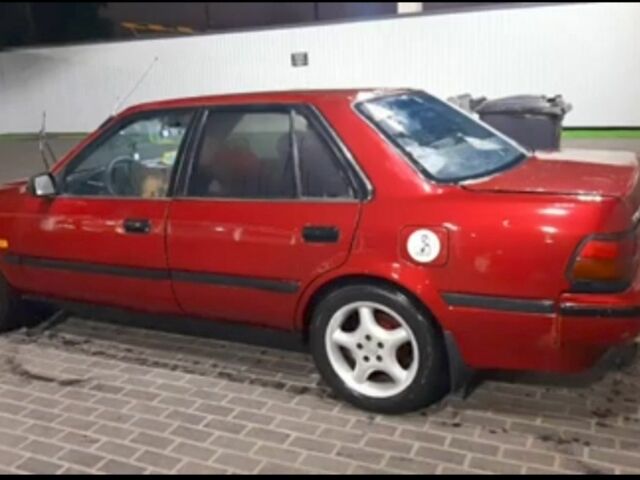 Красный Тойота Карина, объемом двигателя 2 л и пробегом 350 тыс. км за 1600 $, фото 1 на Automoto.ua