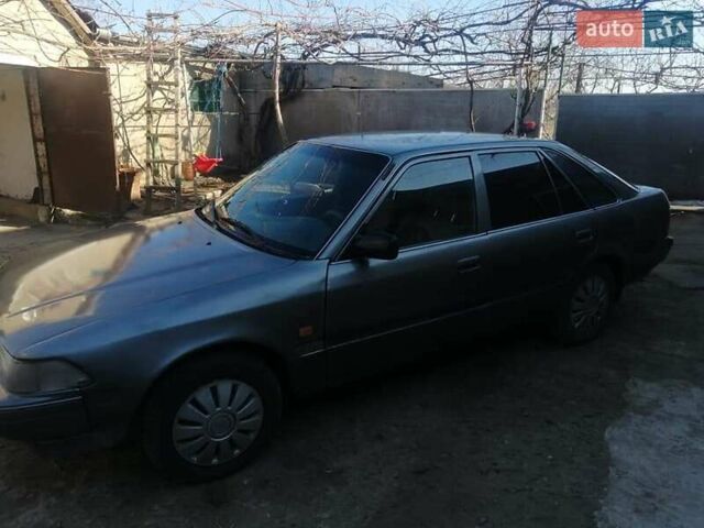 Серый Тойота Карина, объемом двигателя 1.6 л и пробегом 410 тыс. км за 1400 $, фото 1 на Automoto.ua