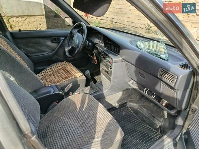 Серый Тойота Карина, объемом двигателя 1.98 л и пробегом 280 тыс. км за 2000 $, фото 1 на Automoto.ua