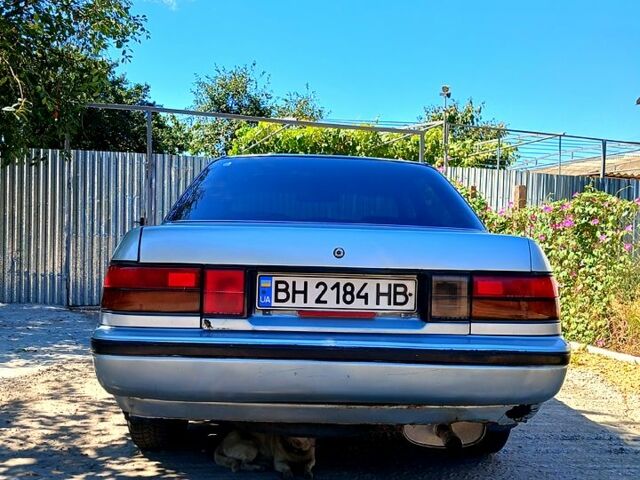 Серый Тойота Карина, объемом двигателя 1.6 л и пробегом 350 тыс. км за 1800 $, фото 1 на Automoto.ua