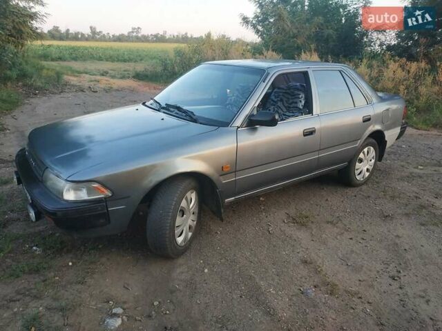 Серый Тойота Карина, объемом двигателя 1.59 л и пробегом 185 тыс. км за 1800 $, фото 1 на Automoto.ua