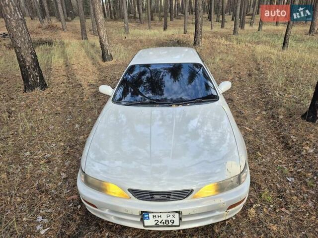 Серый Тойота Карина, объемом двигателя 2 л и пробегом 304 тыс. км за 3000 $, фото 1 на Automoto.ua