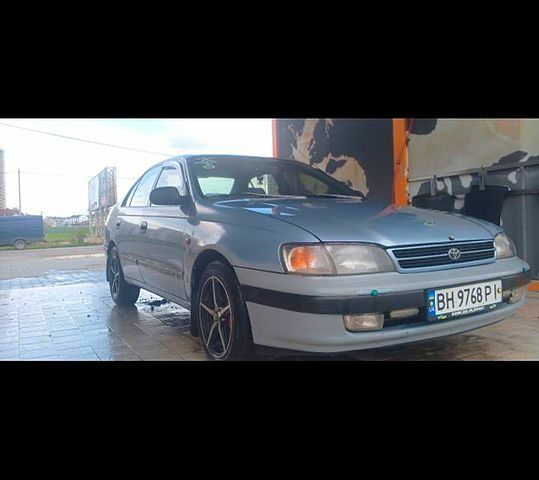 Серый Тойота Карина, объемом двигателя 1.6 л и пробегом 395 тыс. км за 2500 $, фото 1 на Automoto.ua