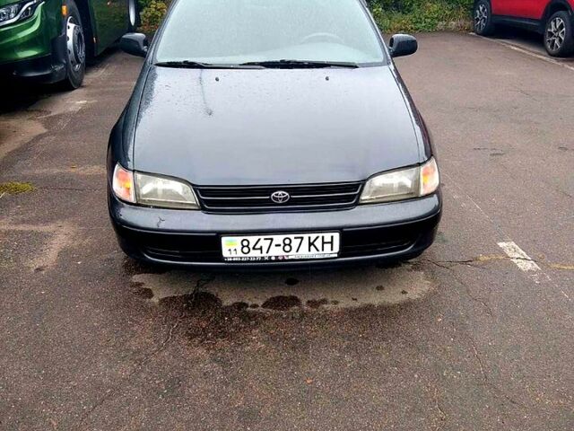 Серый Тойота Карина, объемом двигателя 2 л и пробегом 350 тыс. км за 1300 $, фото 1 на Automoto.ua