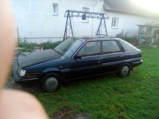 Синий Тойота Карина, объемом двигателя 1 л и пробегом 300 тыс. км за 450 $, фото 1 на Automoto.ua