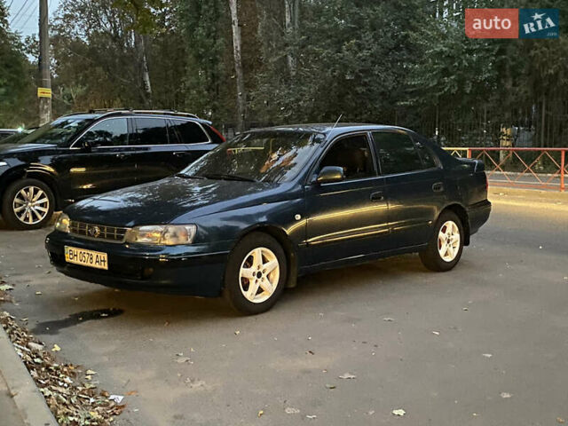 Зеленый Тойота Карина, объемом двигателя 1.6 л и пробегом 470 тыс. км за 1000 $, фото 1 на Automoto.ua