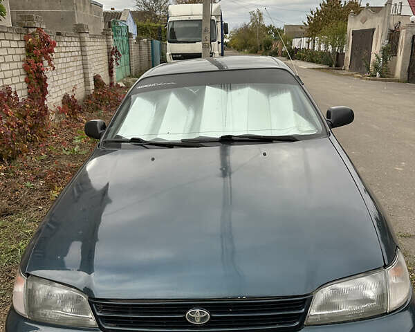 Зеленый Тойота Карина, объемом двигателя 2 л и пробегом 500 тыс. км за 1500 $, фото 1 на Automoto.ua