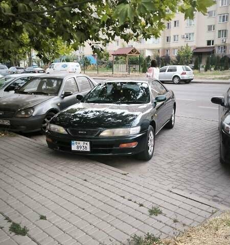 Зеленый Тойота Карина, объемом двигателя 2 л и пробегом 450 тыс. км за 3500 $, фото 1 на Automoto.ua