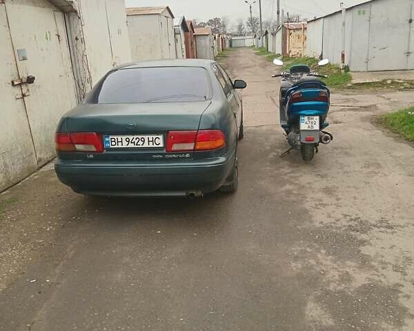 Зелений Тойота Каріна, об'ємом двигуна 1.76 л та пробігом 345 тис. км за 3500 $, фото 1 на Automoto.ua