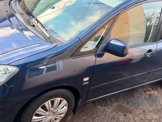 Синий Тойота Королла Версо, объемом двигателя 2 л и пробегом 340 тыс. км за 4500 $, фото 1 на Automoto.ua